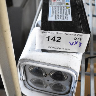Leoch battery and two Rockville lights on shelf, slight wear, auction lot label reading "142 QTY VX3".