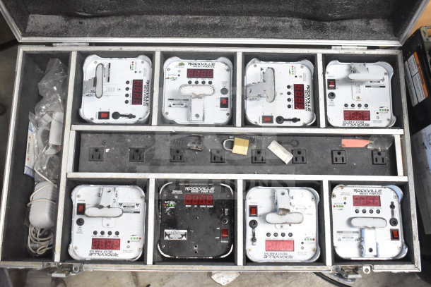 Rockville hard case with 8 Rockville Best Par 50 rechargeable par cans, visible controls, some wear, power outlets inside case.