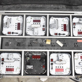 Rockville hard case with 8 Rockville Best Par 50 rechargeable par cans, visible controls, some wear, power outlets inside case.
