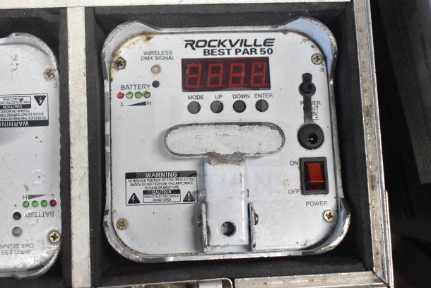 Rockville Best Par 50 rechargeable Par Can in a hard case, showing control panel with DMX signal and battery indicators.