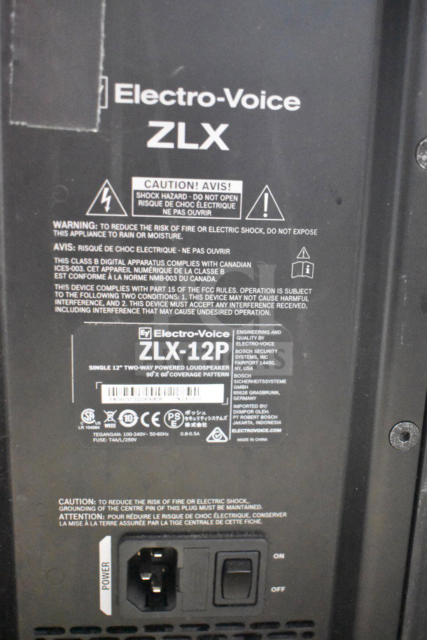 Electro-Voice ZLX-12P speaker label highlighting model details, warnings, power input, and compliance information.