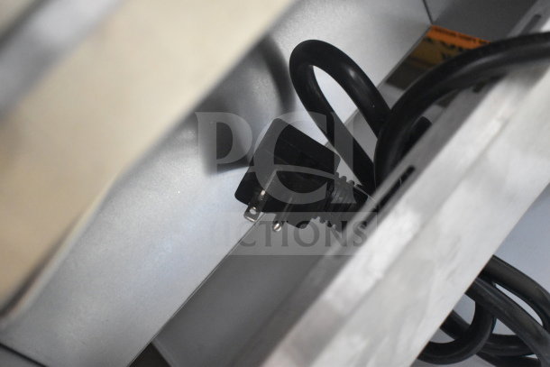 Avantco countertop conveyor pizza oven plug and power cord, indicating functionality and electrical connectivity.