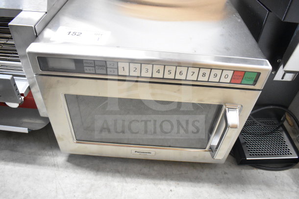 Panasonic NE-17523 commercial microwave oven, stainless steel, keypad controls, model label visible, good condition.