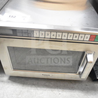 Panasonic NE-17523 commercial microwave oven, stainless steel, keypad controls, model label visible, good condition.