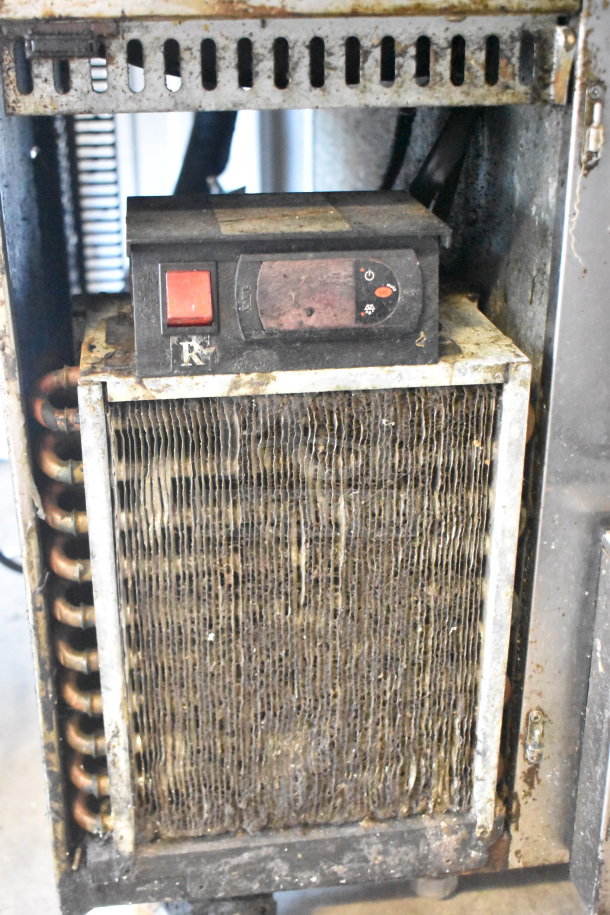 Commercial 4 Drawer Chef Base, worn condition, on commercial casters. Requires 115 Volts, 1 Phase. Visible corrosion.