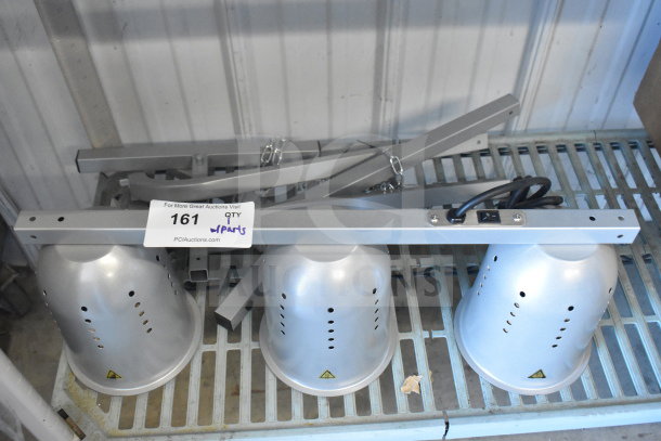 BRAND NEW SCRATCH AND DENT Avantco 3 Head Warming Lamp, silver with visible switch on rail, includes parts.