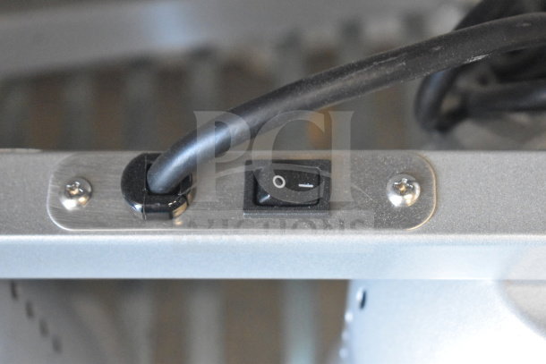 Avantco 3 Head Warming Lamp, brand new, control switch close-up. Scratch and dent model, cord and metal casing visible.