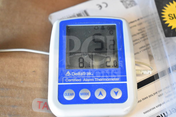 DeltaTrak certified alarm thermometer displaying temperature. Includes Curtis spigots and drip tray. Bid multiplies x3.