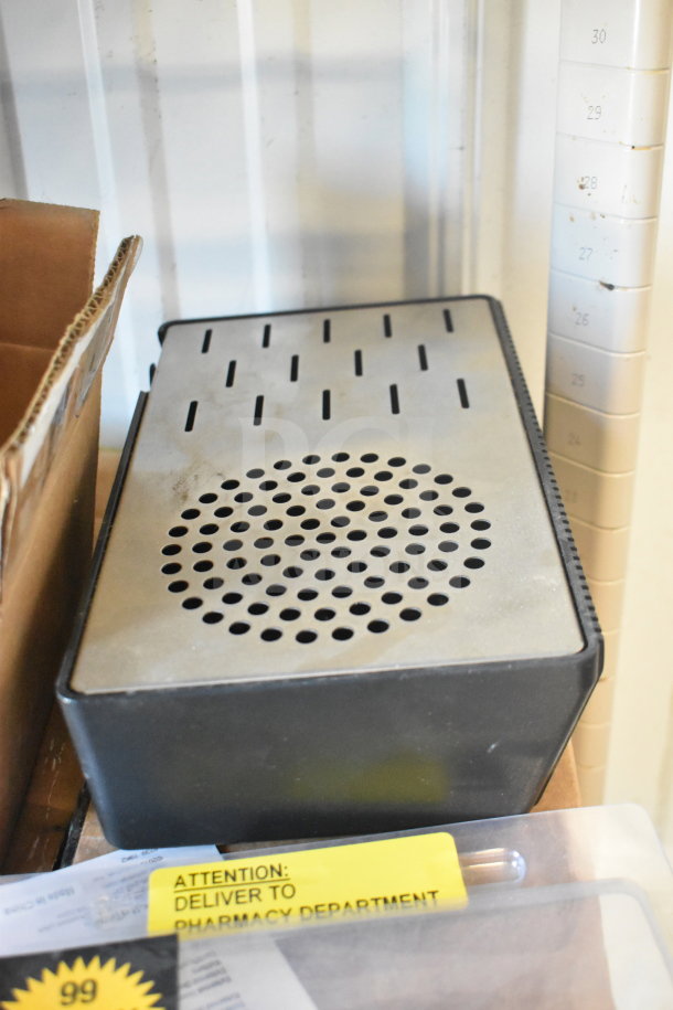 Auction items including a DeltaTrak thermometer, Curtis spigots, and a metal drip tray. Condition: used. "Deliver to Pharmacy Department" tag visible.