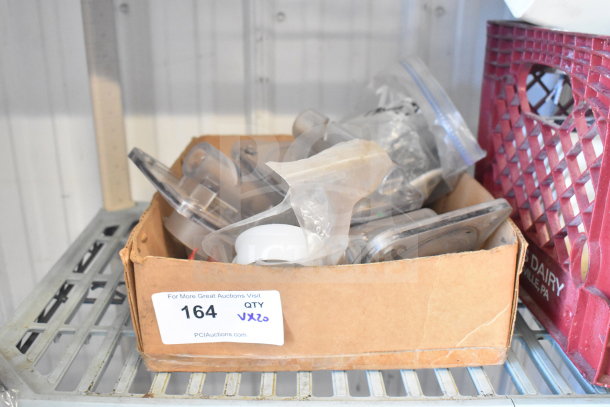 Cardboard box containing various Flavor Burst machine parts and other items, lot label "164 QTY VX20".
