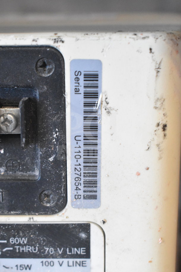 JBL Control 25AV speaker with visible serial number label, showing signs of wear. 60W, 70V/100V line markings noted.