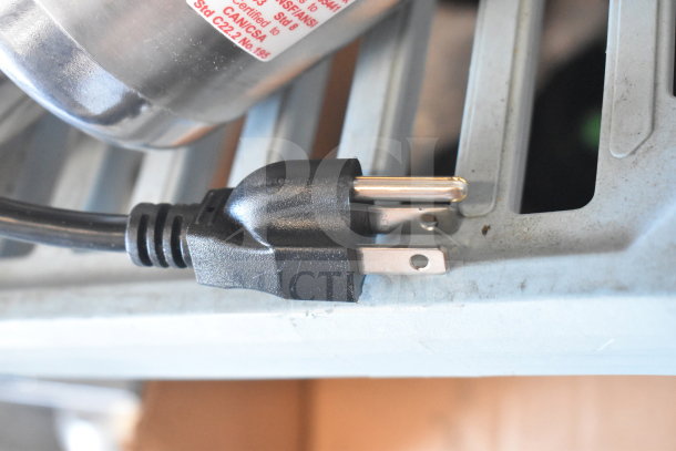 Robot Coupe CMP250 V.V immersion blender plug, showing 120V connection, part of a commercial model. Silver housing visible.