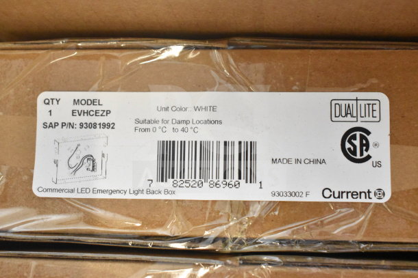 Box containing Dual Lite EVHCEZP emergency light back box, labeled for damp locations, made in China.