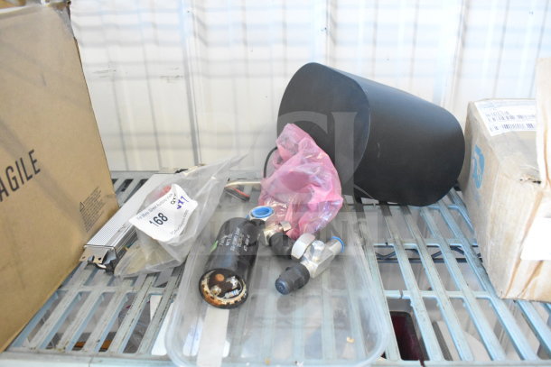 Seven mixed items including Vizio subwoofer, GE LED driver, various hardware parts, and fragile box. Auction label visible.