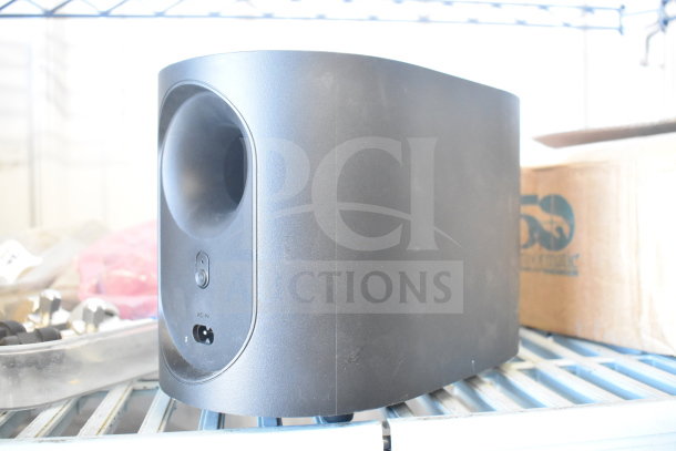Vizio subwoofer in black, rectangular shape, with input ports visible, part of 7 miscellaneous auction items.