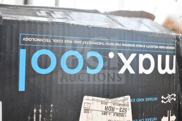 Box containing two Max Cold high velocity fans, visible branding, slightly worn packaging. Labels display shipping details.