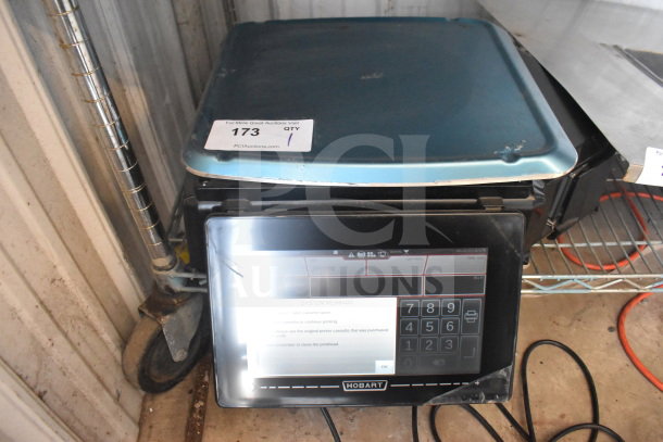 2024 Hobart HTi-7LH4W food portioning scale, tested and working, features electronic display. Model label and tag visible.
