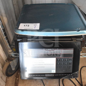 2024 Hobart HTi-7LH4W food portioning scale, tested and working, features electronic display. Model label and tag visible.