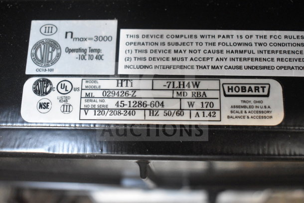 2024 Hobart HTi-7LH4W commercial food scale label showing model, serial number, voltage, and certification details.