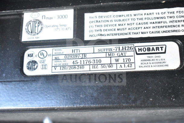2017 Hobart HTi-7LH26 scale label showing model, serial number, voltage, and UL/NSF certifications.
