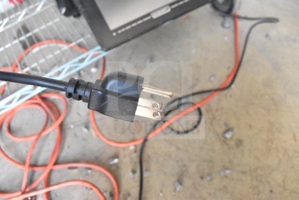 2023 Hobart HTi-7LH4W food portioning scale plug showing standard three-prong connector.