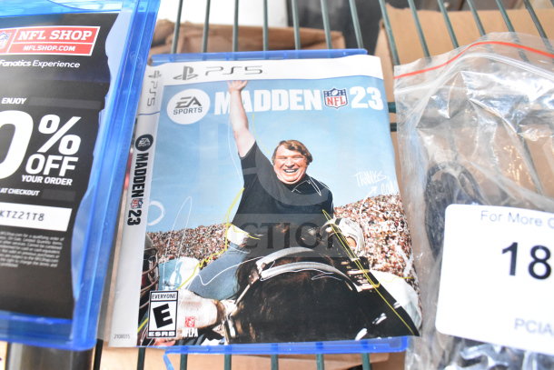 PS5 Madden 23 game case, visible discount label on packaging, part of 4 auction items including 2 microphones.