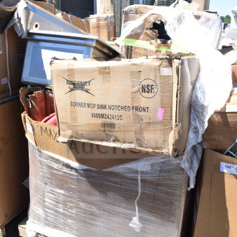 Box of 12 brand new scratch and dent items including Regency corner mop sink. Damaged packaging with NSF label visible.