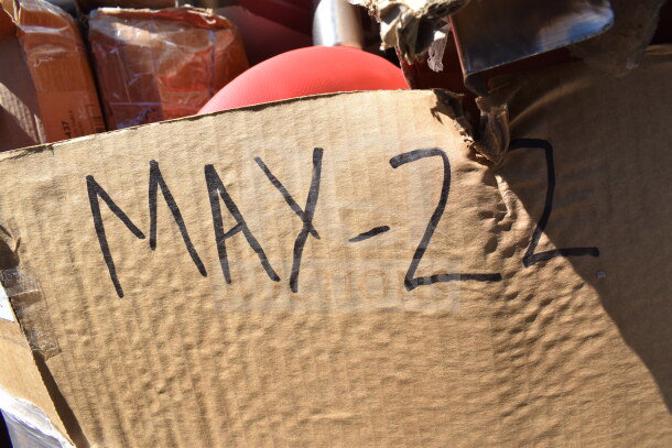 Cardboard box with "MAY-22" written on it, containing 12 brand new scratch and dent items, including a utility cart and dispenser.