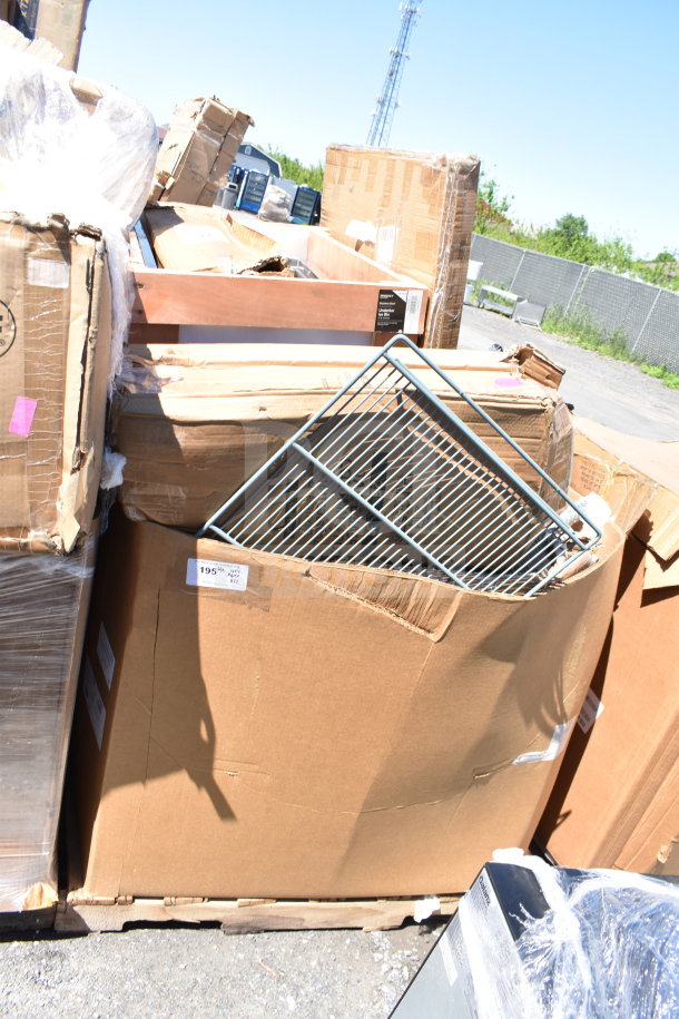 Large cardboard boxes showing 12 brand new scratch-and-dent items, including tabletop and table base columns, stacked outdoors.