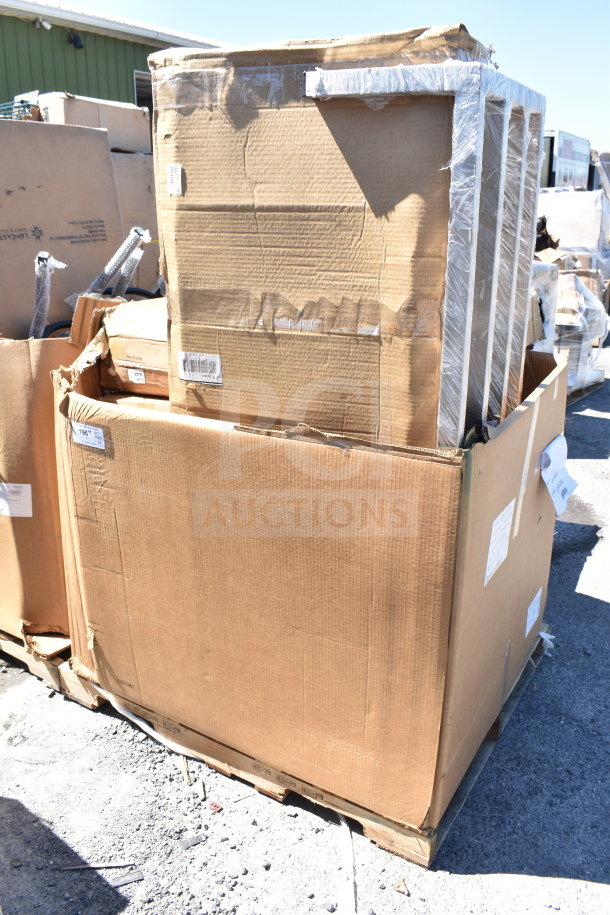 Cardboard boxes containing five new scratch and dent items, including a dunnage rack, wrapped on a pallet outdoors.