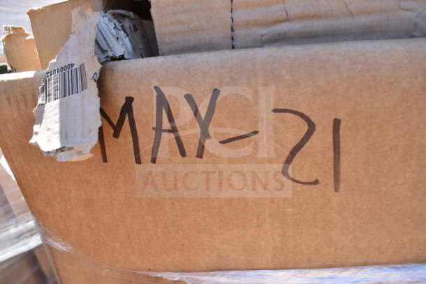 Cardboard box with "MAY-21" handwritten; bar code visible. Contains brand new scratch and dent items, including work table.