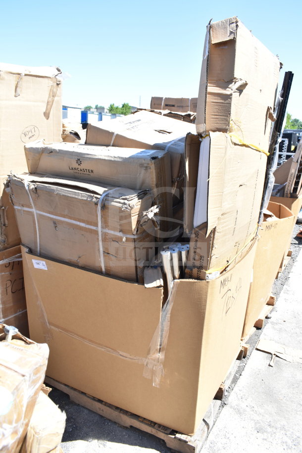 Cardboard boxes with "Lancaster" branding, containing 15 new scratch and dent items, including forks and fryer basket.