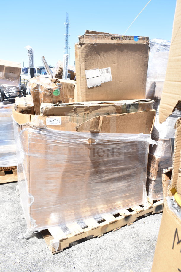 Stack of scratch and dent items on a pallet, wrapped in plastic. Includes microwave shelf, smoker box. Boxes show wear.