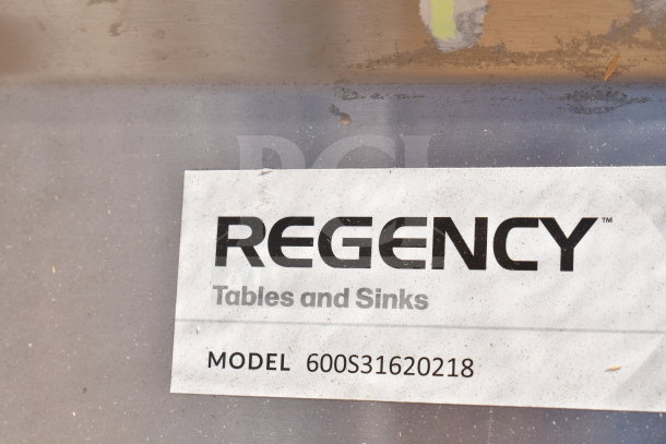 "Regency 600S31620218 commercial sink label. Brand new, scratch and dent condition. Features three compartments, dual drain boards."