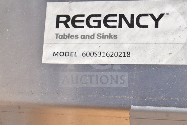Regency 600S31620218 label on three-compartment commercial sink with dual drain boards, shown as brand new scratch and dent.