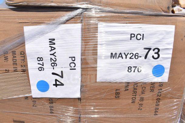 Cardboard boxes wrapped in plastic, labeled "PCI MAY26-74" and "MAY26-73" with blue dots, containing scratch and dent items.
