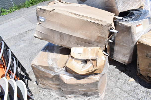 Four boxed items, labeled "scratch and dent," wrapped in plastic. Boxes are visibly damaged. Some metal chair legs are partially visible.