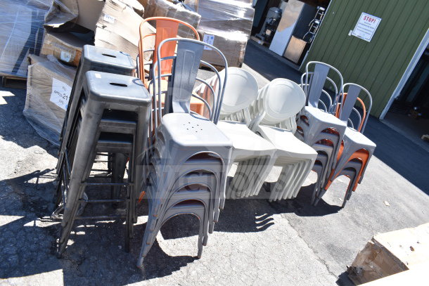 Brand new scratch and dent items: gray and orange Tolix style chairs, bar stools, white patio chairs, outdoors.