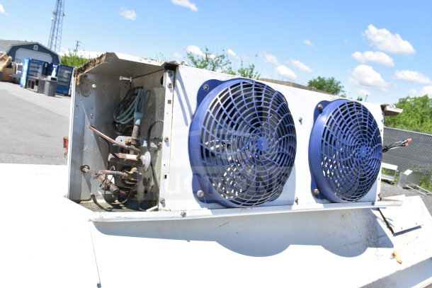 Master-Bilt walk-in box compressor and evaporator fan with blue grilles, outdoor setup, shows wiring and copper pipes.