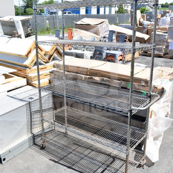 Chrome finish 5-tier wire shelving unit with casters, one missing. Buyer must dismantle. Consider freight charges.
