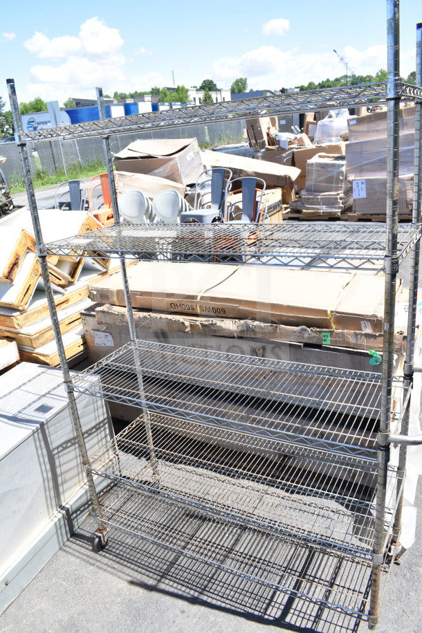 Chrome finish 5-tier wire shelving unit with casters, one caster missing. Dismantling required by buyer. Consider freight.