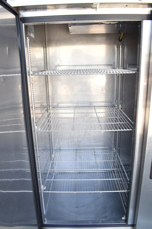 Turbo Air TSR-49SD commercial 2 door reach-in cooler, stainless steel interior, visible shelves, 115 volts, 1 phase.