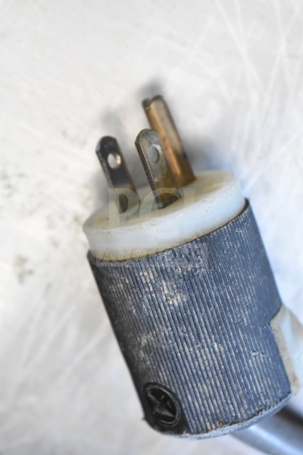 Close-up of a three-prong electrical plug compatible with the Turbo Air TSR-49SD Commercial Cooler, 115 Volts, 1 Phase.