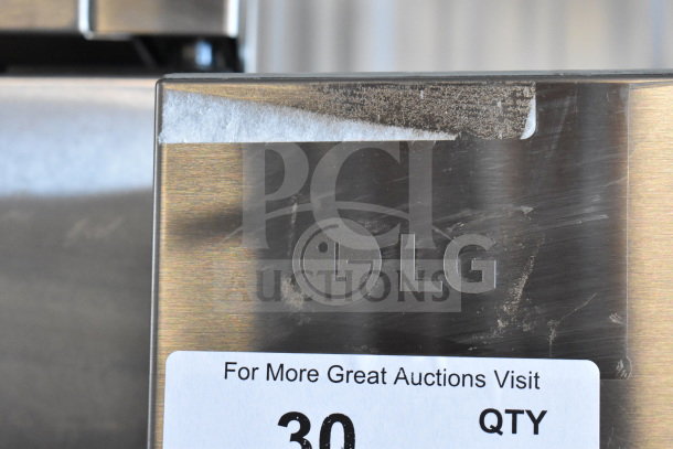 LG LT18S2100S/00 cooler with freezer, stainless steel finish, visible LG logo, 115V, 1 Phase, auction tag attached.