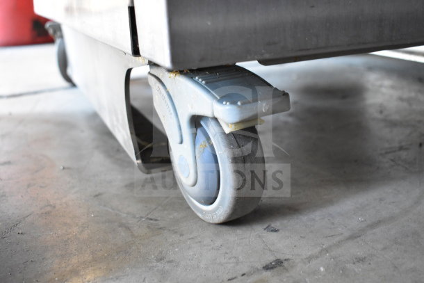 JBT 2ND-GEN-MFJ citrus juicer wheel detail; commercial caster for mobility.
