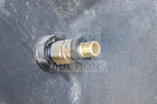 Close-up of Portacool PACJS2501A1 Jetstream 250 cooler hose connector, showing brass fitting and black sealing gasket.