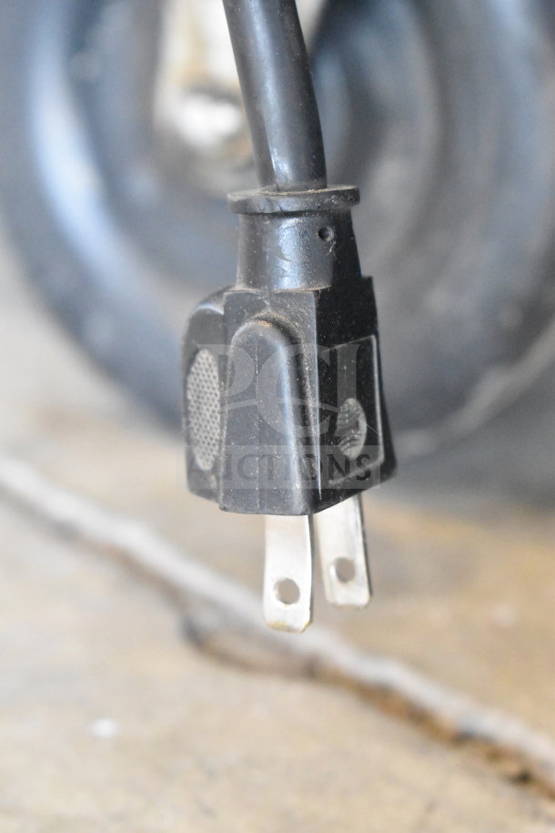 Close-up of a power plug from a Portacool Jetstream 250 PACJS2501A1 cooler, showing a standard two-prong connector.