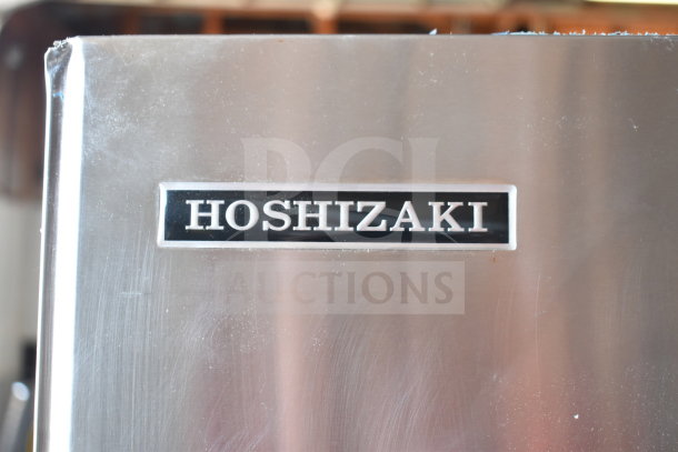 Hoshizaki Commercial Ice Head on B-300SF Bin. Stainless steel, visible Hoshizaki logo. Suitable for high-capacity ice needs.