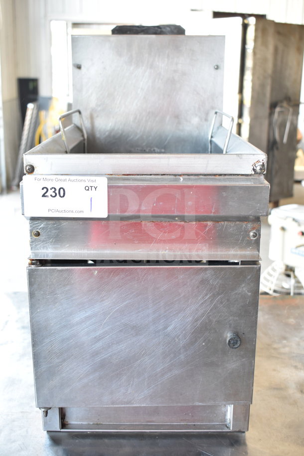 Commercial countertop gas-powered deep fat fryer, stainless steel, used, some scratches. Auction label: "230 QTY 1."