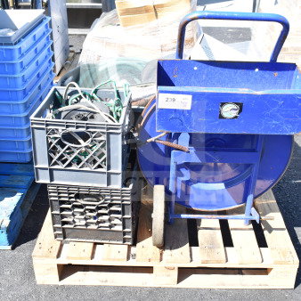 Pallet lot with banding station, crate of cords, and blue cart. Visible tags indicate quantity as "Pallet 1."